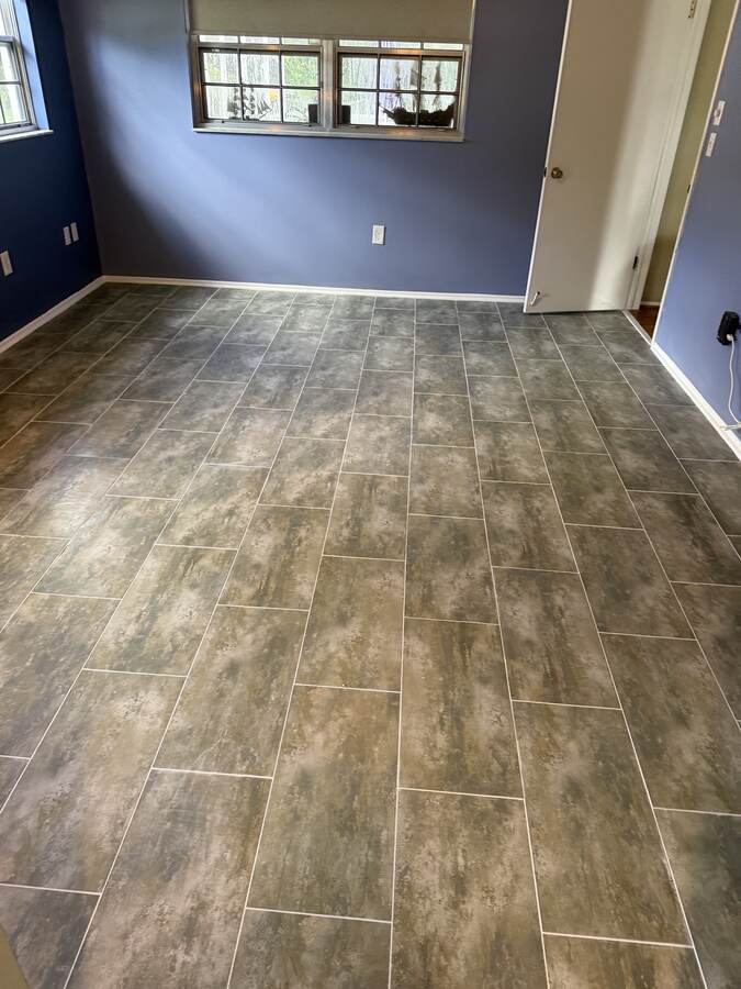 Finished gray flooring with clean layout lines in Hudson Florida