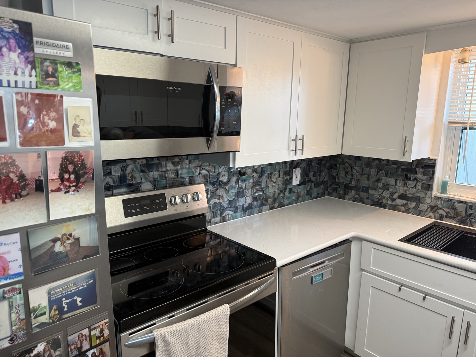 Completed Port Richey backsplash tile project behind stove and microwave by AG Holmes Handyman Services