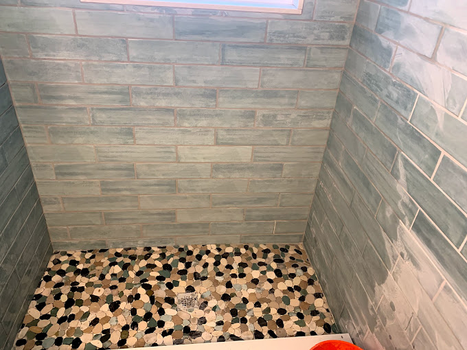Custom shower tile installation with clean grout lines and modern design