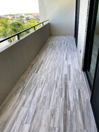 Vinyl plank flooring installation with wood‑grain finish