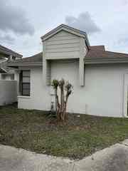 After cement siding repair, exterior trim carpentry and painting in Port Richey
