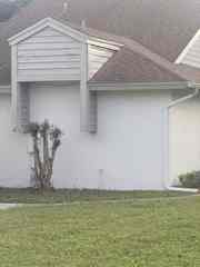 Before cement siding and exterior trim repair on a Port Richey home